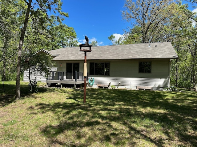 32305 W St, Breezy Point, MN 56472 - back of house with a lawn and a deck
