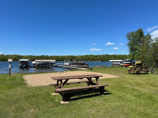 32305 W St, Breezy Point, MN 56472 - surrounding community featuring a yard, a water view, and a dock