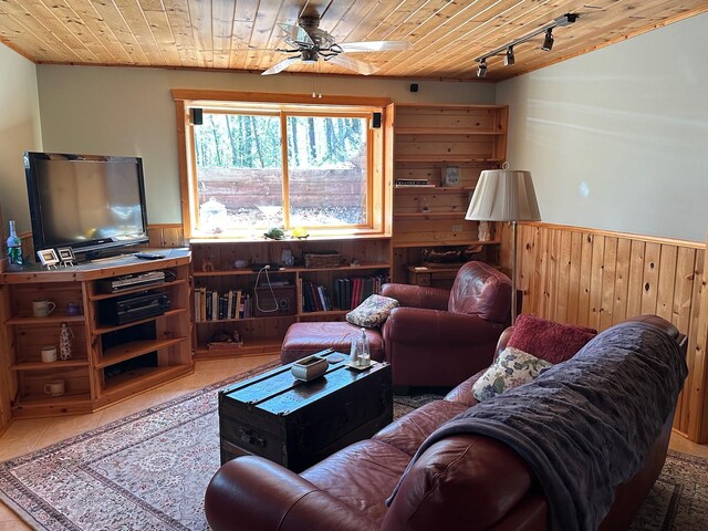 32305 W St, Breezy Point, MN 56472 - living area with wood ceiling, wood walls, wainscoting, ceiling fan, and rail lighting