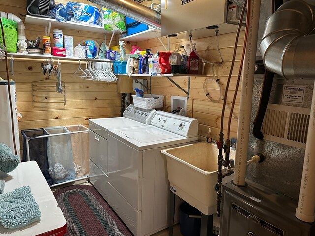 32305 W St, Breezy Point, MN 56472 - laundry room featuring independent washer and dryer, wood walls, and water heater