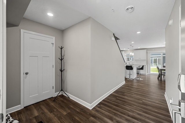 1144 Middlefield Rd, Medina, MN 55340 - foyer with dark wood finished floors, baseboards, and recessed lighting