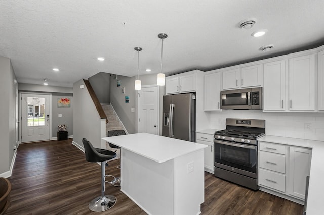 1144 Middlefield Rd, Medina, MN 55340 - kitchen featuring stainless steel appliances, white cabinets, dark wood-style flooring, baseboards, and recessed lighting