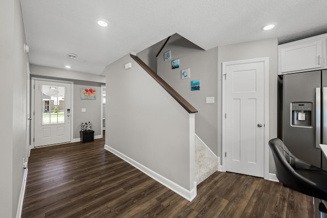 1144 Middlefield Rd, Medina, MN 55340 - entrance foyer with dark wood-style floors, baseboards, stairs, recessed lighting, and a textured ceiling