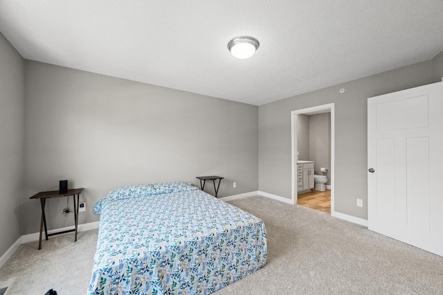 1144 Middlefield Rd, Medina, MN 55340 - carpeted bedroom featuring baseboards and ensuite bath