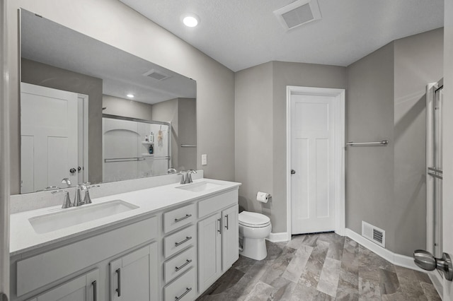 1144 Middlefield Rd, Medina, MN 55340 - bathroom with a shower stall, toilet, baseboards, double vanity, and recessed lighting