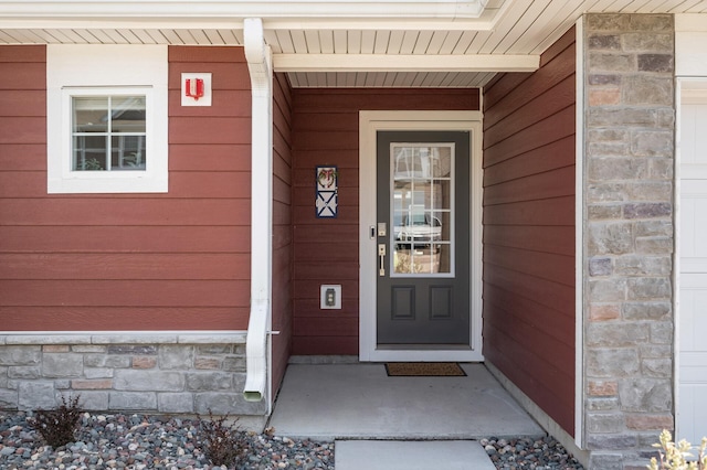 1144 Middlefield Rd, Medina, MN 55340 - view of exterior entry featuring covered porch and stone siding