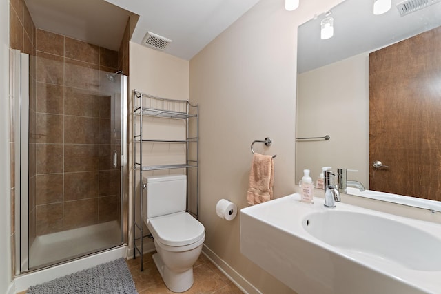 1920 Kyle Pl, Golden Valley, MN 55422 - full bath featuring toilet, tile patterned floors, a stall shower, a sink, and baseboards