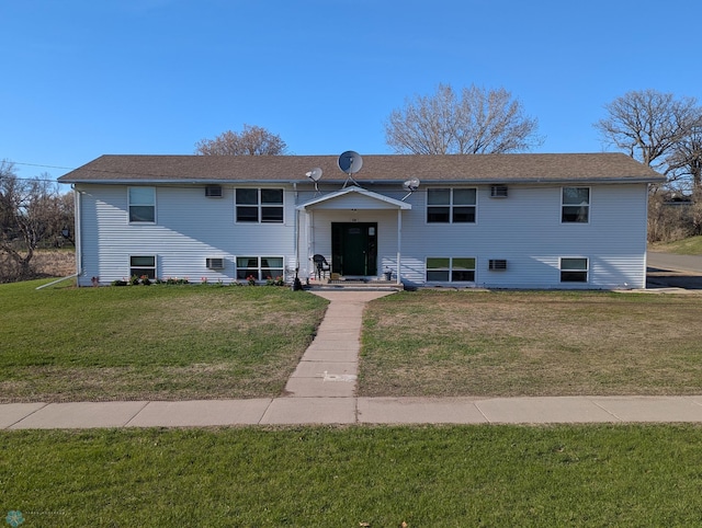 bi-level home featuring a front yard