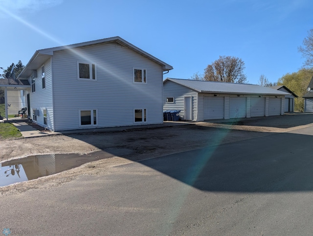 view of side of home with an outdoor structure