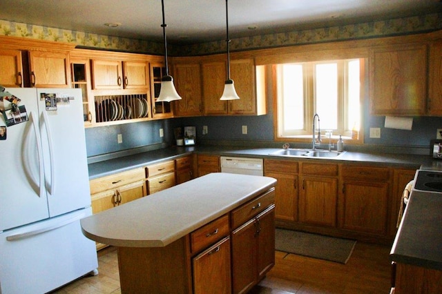 kitchen featuring a center island, open shelves, brown cabinets, a sink, and white appliances