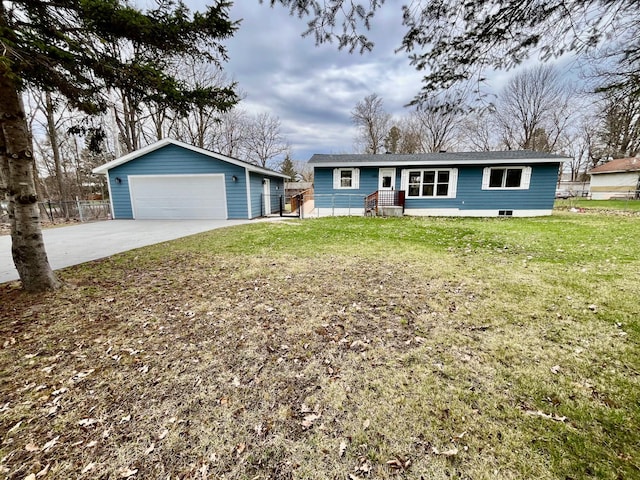ranch-style house featuring a detached garage, fence, an outbuilding, and a front yard