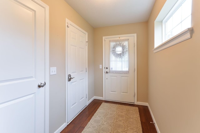 6942 151st St, Savage, MN 55378 - doorway with healthy amount of natural light, dark wood-style flooring, and baseboards