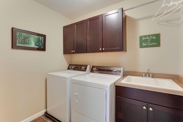 6942 151st St, Savage, MN 55378 - washroom with cabinet space, washing machine and clothes dryer, baseboards, and tile patterned floors