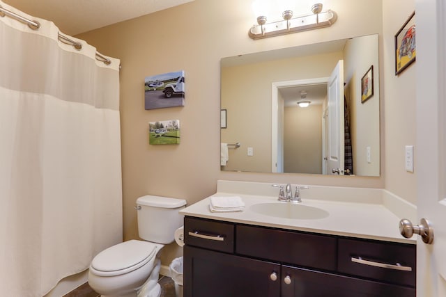 6942 151st St, Savage, MN 55378 - bathroom featuring toilet, vanity, a shower with curtain, and baseboards
