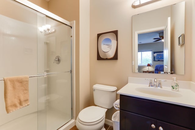 6942 151st St, Savage, MN 55378 - bathroom with a stall shower, vanity, toilet, baseboards, and ceiling fan