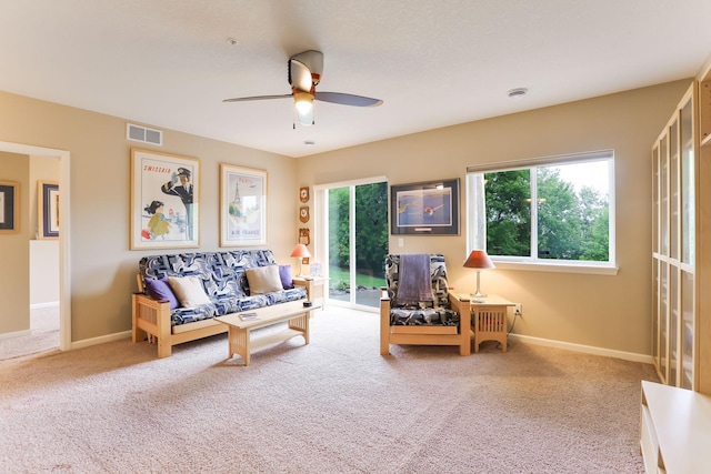 6942 151st St, Savage, MN 55378 - living area with carpet flooring, healthy amount of natural light, and a ceiling fan