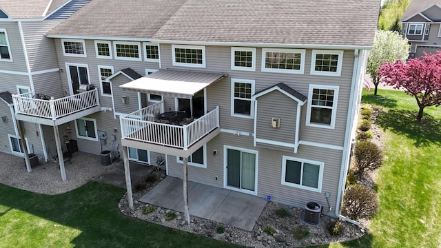6942 151st St, Savage, MN 55378 - back of property with a patio area, a yard, a shingled roof, and cooling unit
