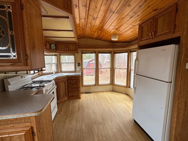 kitchen featuring white appliances, brown cabinetry, light wood-type flooring, vaulted ceiling, and wood ceiling