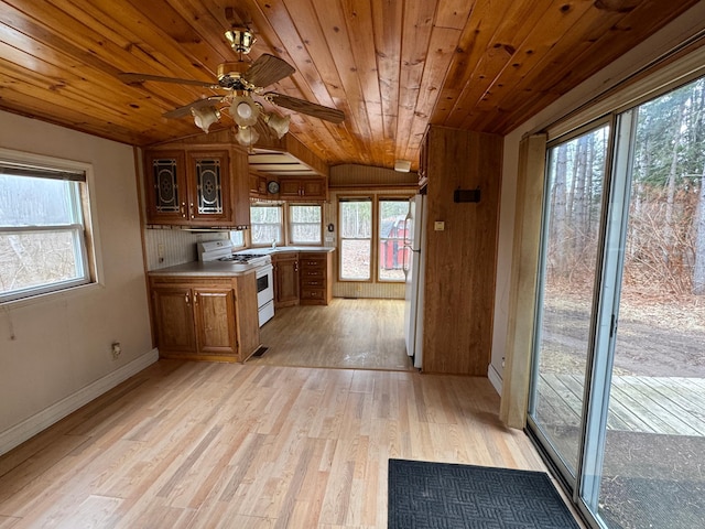 kitchen with wood ceiling, ceiling fan, brown cabinets, white appliances, and light wood-style flooring