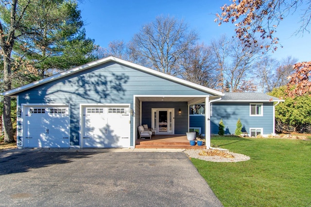5360 Marohn Rd, Baxter, MN 56425 - ranch-style house featuring covered porch, aphalt driveway, a front yard, and a garage