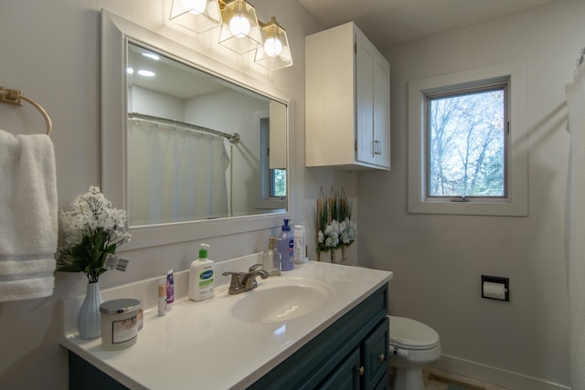 5360 Marohn Rd, Baxter, MN 56425 - full bathroom featuring toilet, baseboards, and vanity
