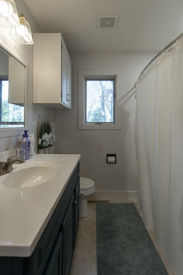 5360 Marohn Rd, Baxter, MN 56425 - full bath with vanity, tile patterned flooring, toilet, and visible vents