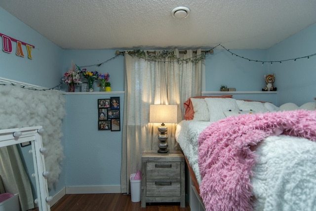 5360 Marohn Rd, Baxter, MN 56425 - bedroom featuring baseboards, a textured ceiling, and wood finished floors