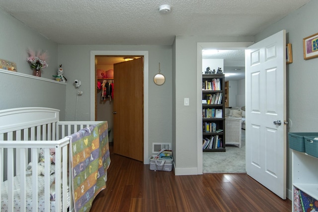 5360 Marohn Rd, Baxter, MN 56425 - bedroom featuring baseboards, dark wood finished floors, a textured ceiling, and visible vents
