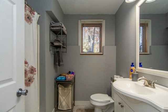5360 Marohn Rd, Baxter, MN 56425 - full bath with vanity, baseboards, tile patterned floors, and toilet