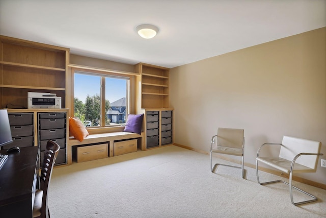 living area with carpet floors and baseboards