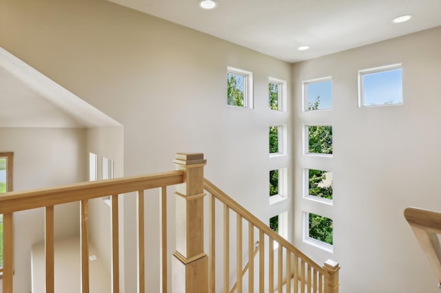 stairs featuring plenty of natural light and recessed lighting