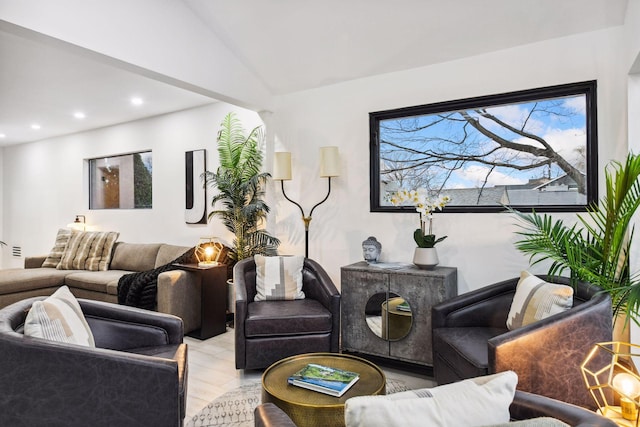 living area with recessed lighting and vaulted ceiling
