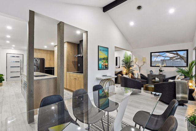dining space with recessed lighting and lofted ceiling with beams
