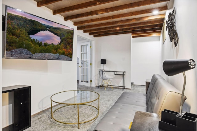 carpeted living area featuring french doors and beam ceiling