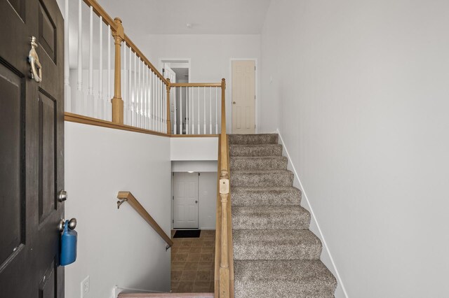stairway featuring baseboards