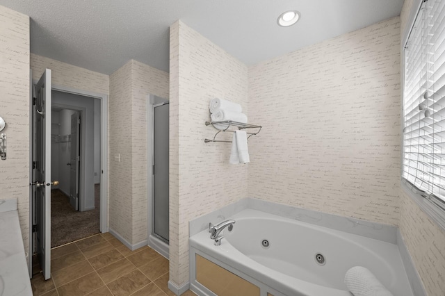 full bathroom with a jetted tub, recessed lighting, tile patterned flooring, and a shower stall