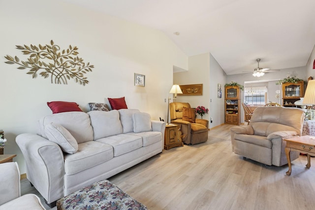 11521 Poppy St NW, Coon Rapids, MN 55433 - living room featuring light wood-type flooring, vaulted ceiling, and a ceiling fan