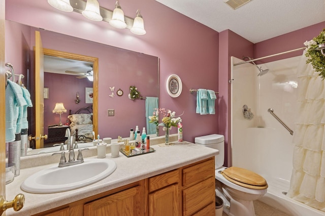 11521 Poppy St NW, Coon Rapids, MN 55433 - full bath with a stall shower, toilet, vanity, ensuite bathroom, and ceiling fan