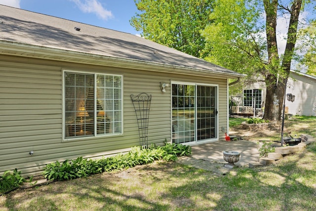 11521 Poppy St NW, Coon Rapids, MN 55433 - back of property with a patio area, a lawn, and a shingled roof