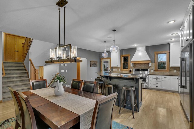 912 21st Ave N, Sartell, MN 56377 - dining area featuring recessed lighting, stairs, and light wood-style flooring