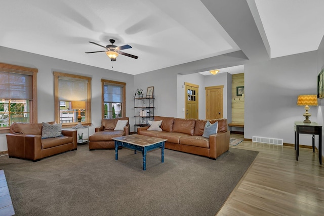 912 21st Ave N, Sartell, MN 56377 - living room featuring a ceiling fan, baseboards, visible vents, and wood finished floors