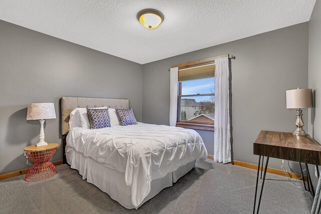 912 21st Ave N, Sartell, MN 56377 - bedroom featuring baseboards, a textured ceiling, and carpet