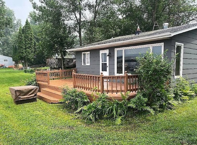 50435 Angle Rd, Pelican Rapids, MN 56572 - back of property featuring a lawn and a wooden deck