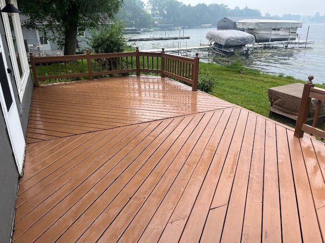 50435 Angle Rd, Pelican Rapids, MN 56572 - wooden terrace with boat lift, a water view, a boat dock, and a grill