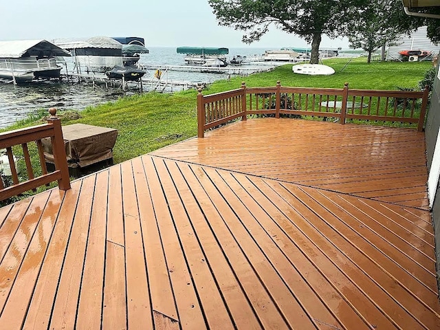50435 Angle Rd, Pelican Rapids, MN 56572 - deck featuring a water view, a yard, boat lift, and a dock