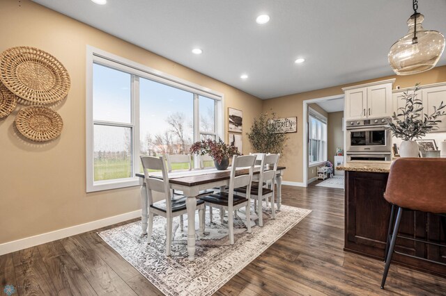 dining room with recessed lighting, baseboards, and dark wood-style flooring
