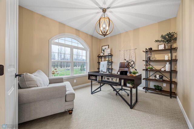 office area with baseboards, a notable chandelier, and carpet