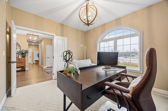 carpeted home office featuring baseboards, a chandelier, and visible vents