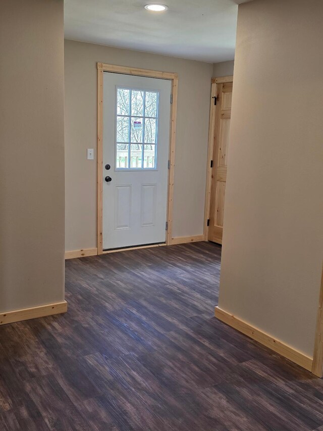 doorway to outside featuring baseboards, recessed lighting, and dark wood finished floors