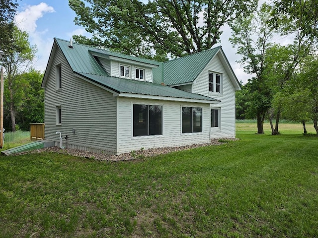 166 95th St, Black Brook Twp, WI 54007 - view of side of property featuring a metal roof and a lawn
